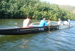 men_in_hawaiian_canoe